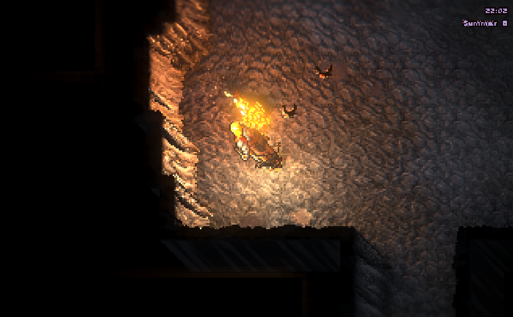 A cave wall lit by a campfire, relit